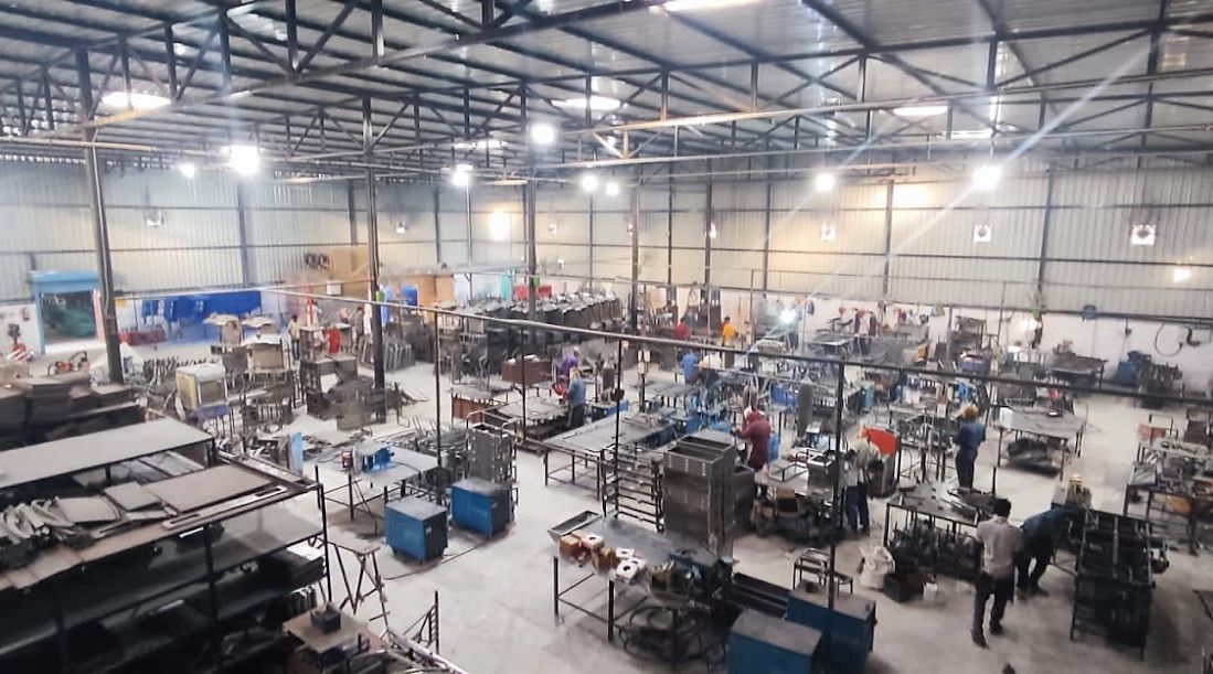 Mitra Stark assembly floor with work benches and welding stations