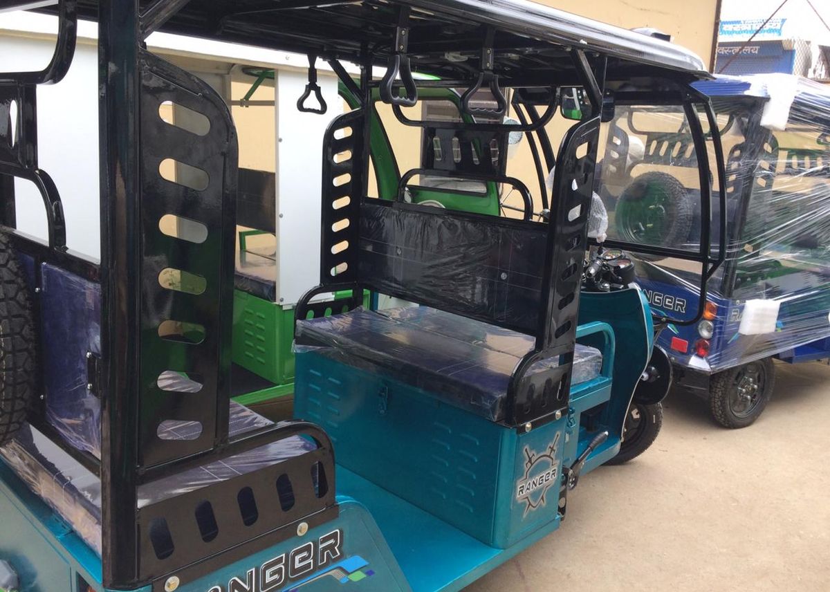 Completed electric passenger three-wheelers ready for dispatch