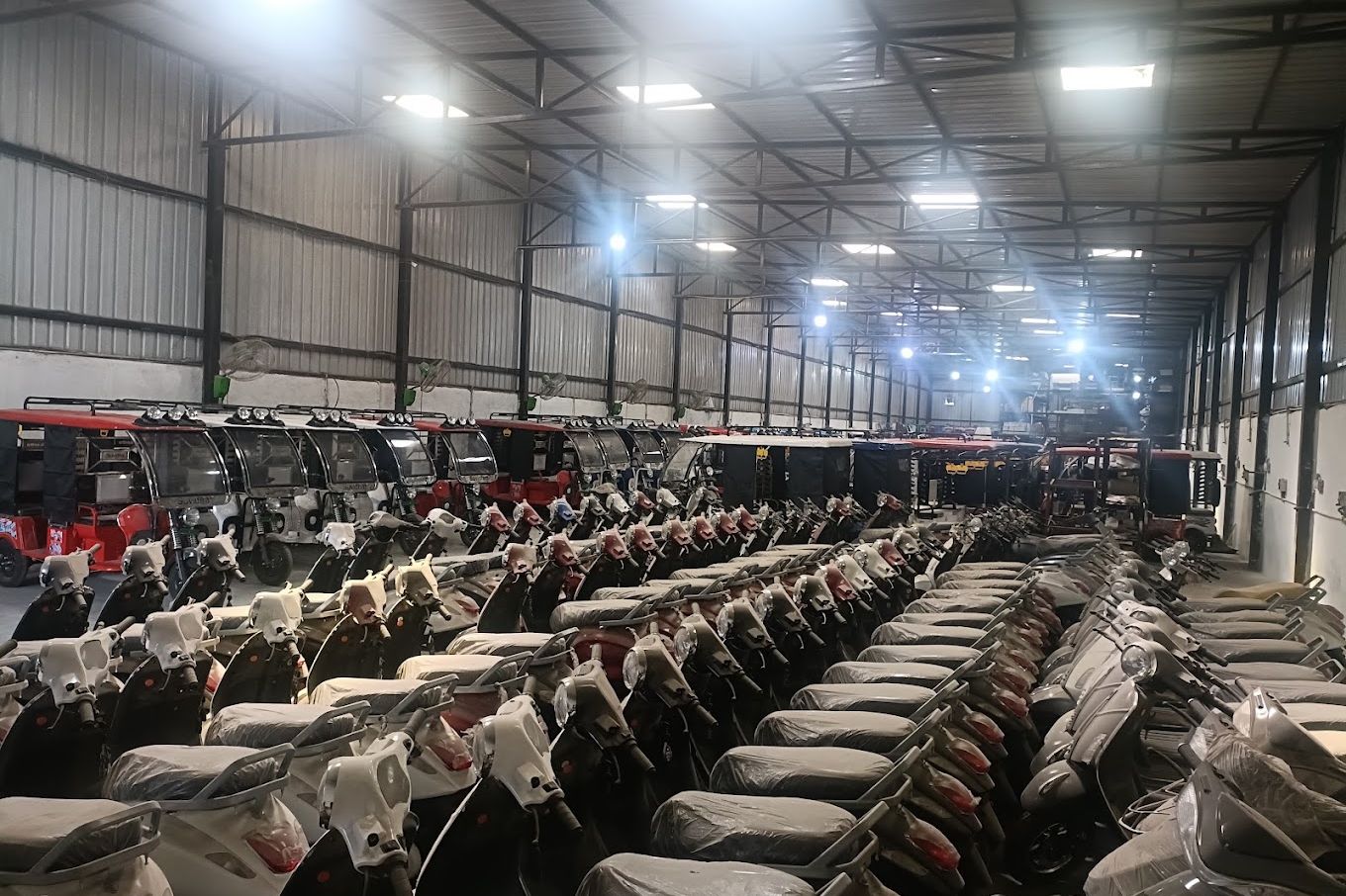 Finished electric scooters lined up in the dispatch warehouse